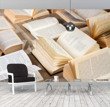Picture of Libros abiertos sobre mesa de madera rstica Vista superior